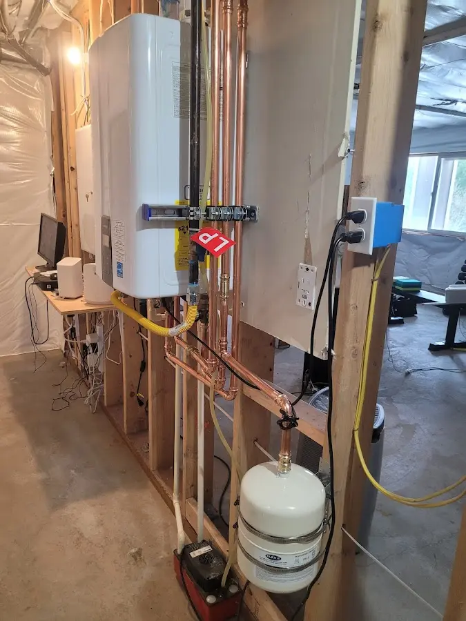 Licensed plumber repairing a kitchen sink in Waller